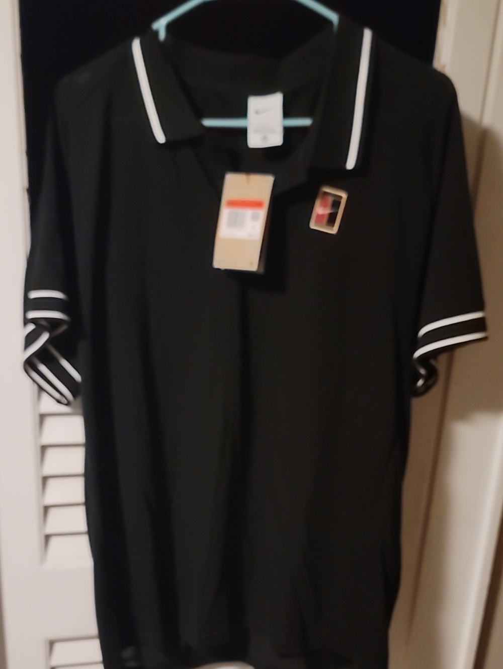 Men's Black Nike Polo Shirt with White Trim